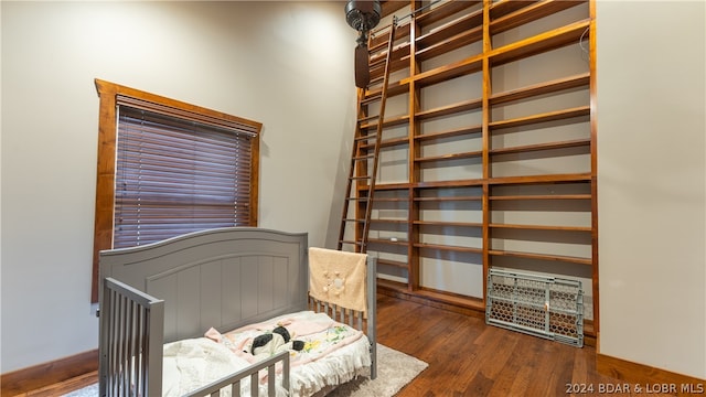 bedroom with hardwood / wood-style floors