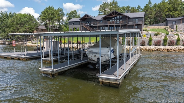 view of dock featuring a deck with water view