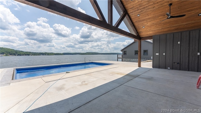 view of swimming pool with a patio