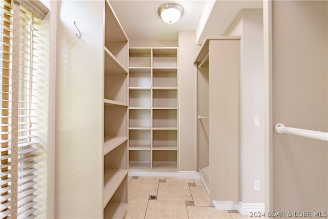 walk in closet featuring light tile patterned floors