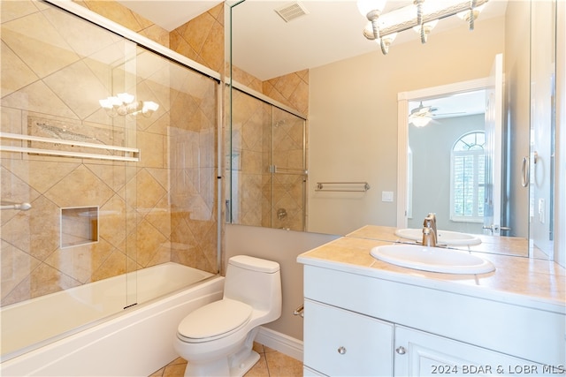 full bathroom with vanity, tile patterned floors, ceiling fan, shower / bath combination with glass door, and toilet