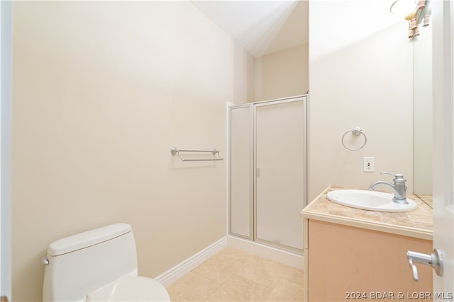 bathroom with walk in shower, tile patterned flooring, toilet, and vanity