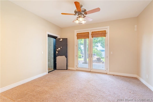 unfurnished room with carpet and ceiling fan