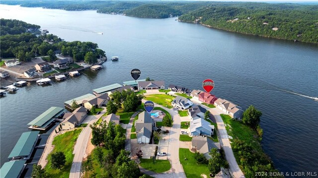 birds eye view of property featuring a water view