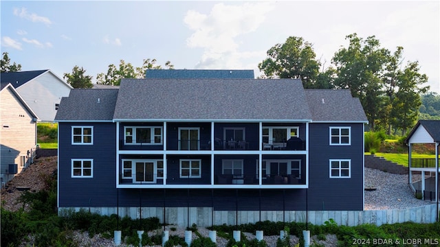 back of property featuring a balcony