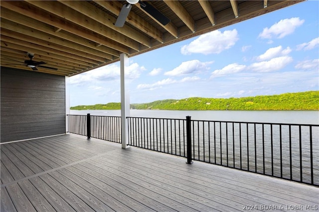 wooden deck featuring a water view and a ceiling fan