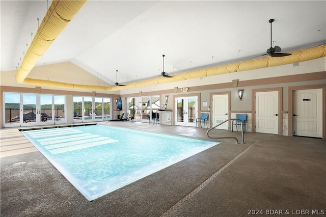 indoor pool with french doors and ceiling fan