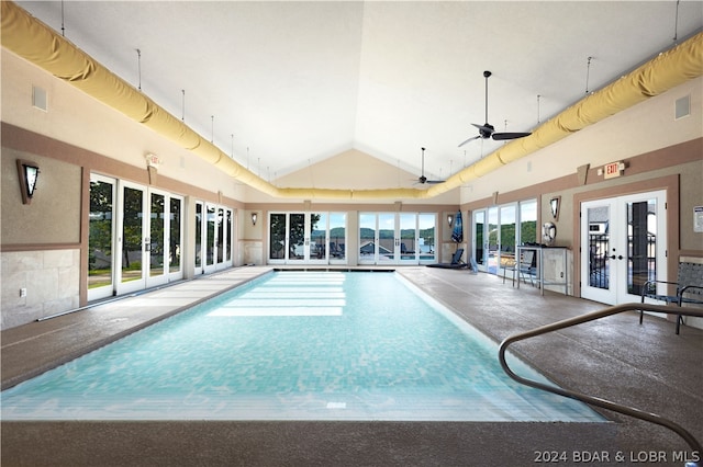 view of swimming pool with ceiling fan and french doors