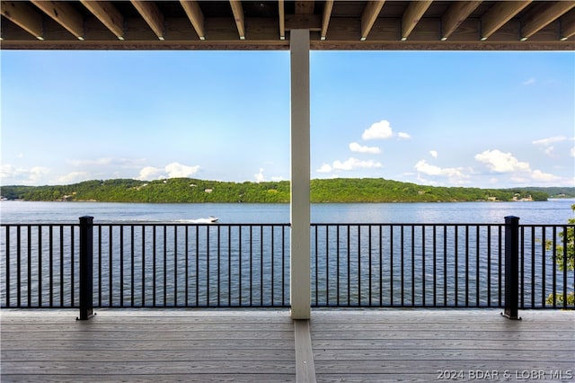 wooden deck with a water view