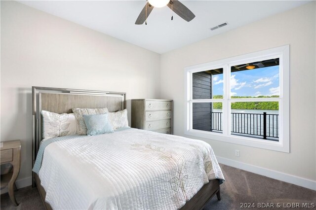 bedroom featuring dark carpet and ceiling fan