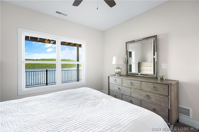 bedroom featuring carpet floors, baseboards, visible vents, and ceiling fan