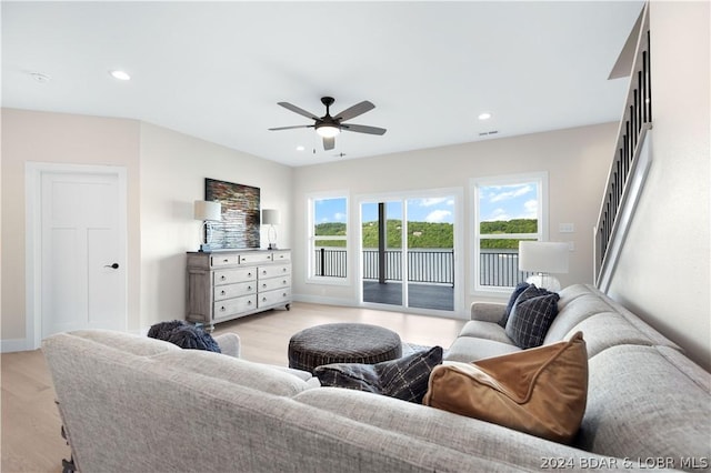 living room with ceiling fan, recessed lighting, visible vents, baseboards, and light wood-style floors