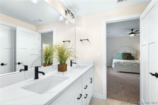 bathroom with ceiling fan and vanity