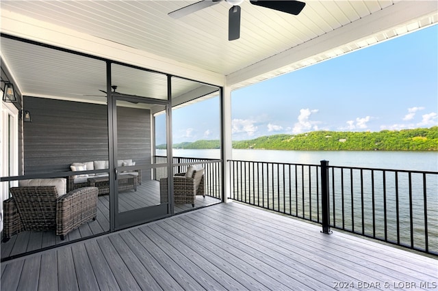 deck featuring a water view and ceiling fan