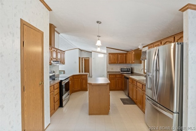 kitchen with a kitchen island, appliances with stainless steel finishes, lofted ceiling, sink, and hanging light fixtures