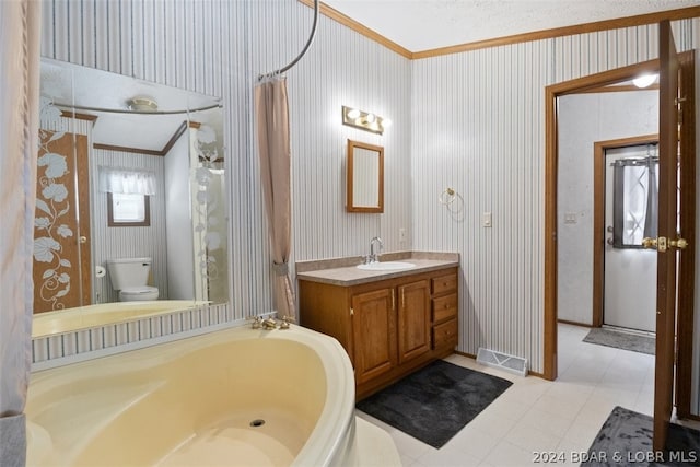 bathroom featuring vanity, crown molding, a bathing tub, and toilet