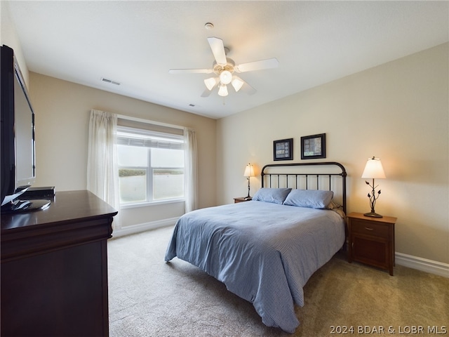 carpeted bedroom featuring ceiling fan