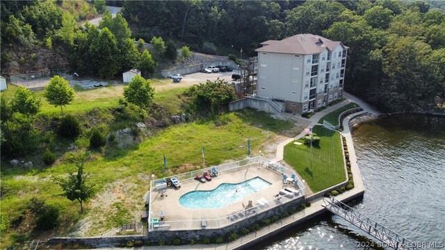 birds eye view of property with a water view