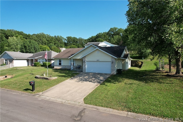 ranch-style home with a garage and a front lawn