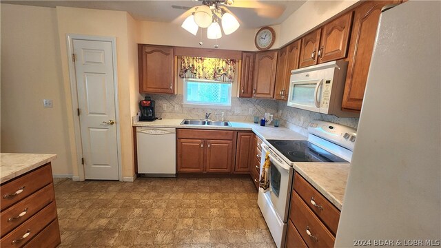 kitchen featuring tasteful backsplash, white appliances, ceiling fan, and sink