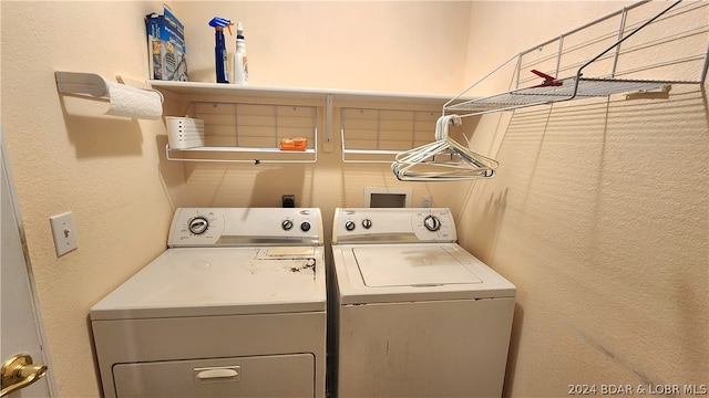 laundry room with independent washer and dryer