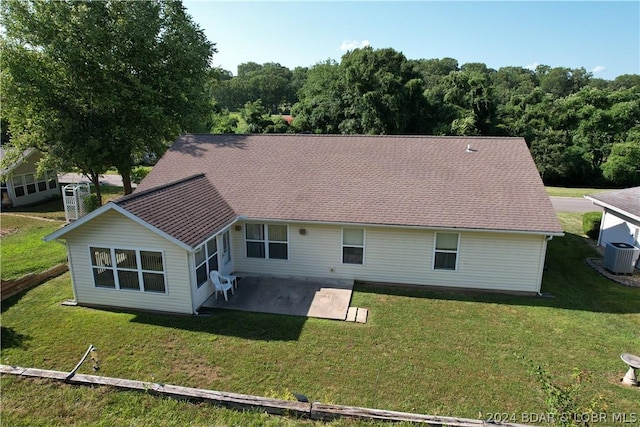 back of house featuring a patio, a yard, and cooling unit