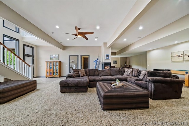 living room with carpet floors and ceiling fan