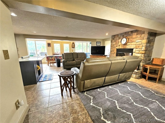 living room featuring a fireplace and a textured ceiling