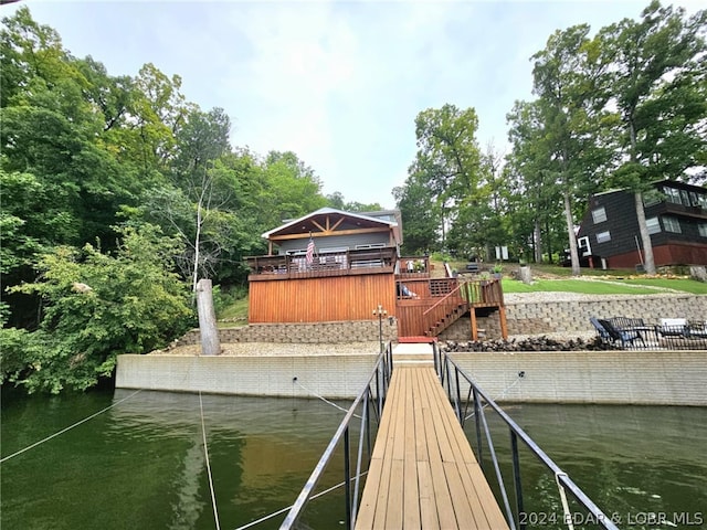 dock area with a water view