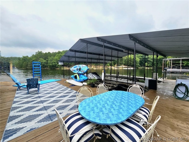 view of patio / terrace with a dock and a water view