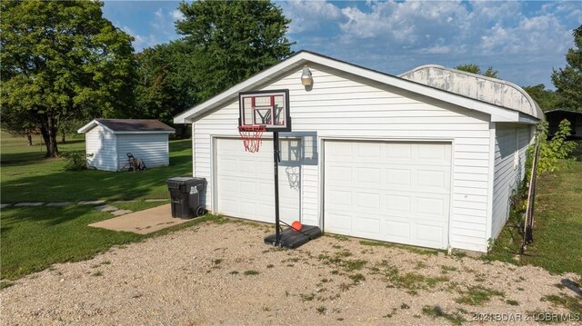 garage featuring a yard