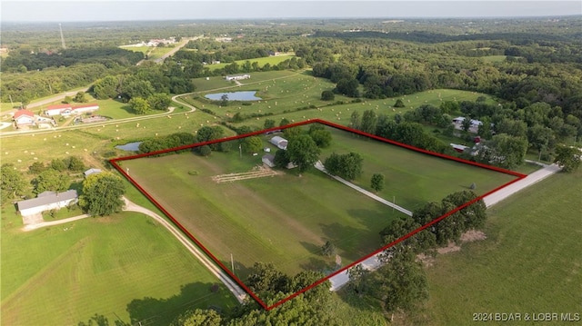 birds eye view of property featuring a rural view