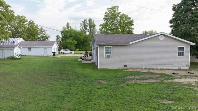 view of property exterior featuring a lawn