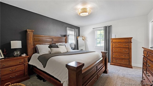 bedroom featuring light colored carpet