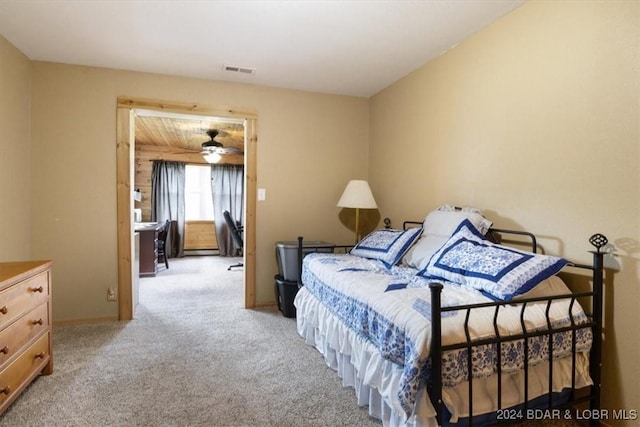 bedroom featuring light colored carpet