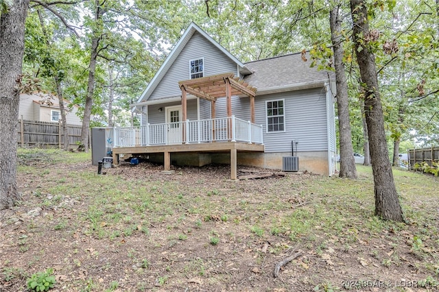 back of property featuring a wooden deck