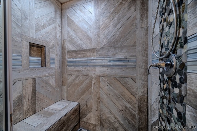 bathroom with tiled shower