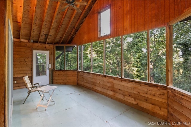 unfurnished sunroom featuring ceiling fan and lofted ceiling