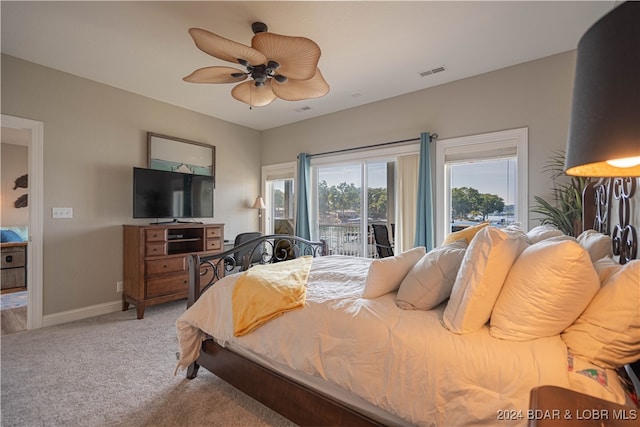 carpeted bedroom featuring ceiling fan and access to exterior