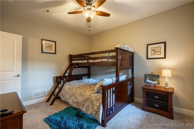 bedroom featuring light colored carpet and ceiling fan