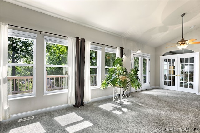 unfurnished sunroom with french doors, ceiling fan, and lofted ceiling