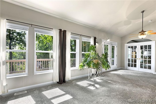 unfurnished sunroom featuring lofted ceiling, french doors, and visible vents