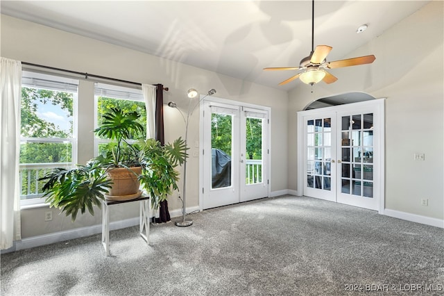 unfurnished sunroom featuring french doors, vaulted ceiling, and ceiling fan