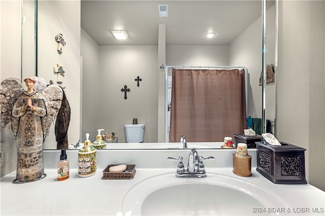 bathroom with toilet and sink