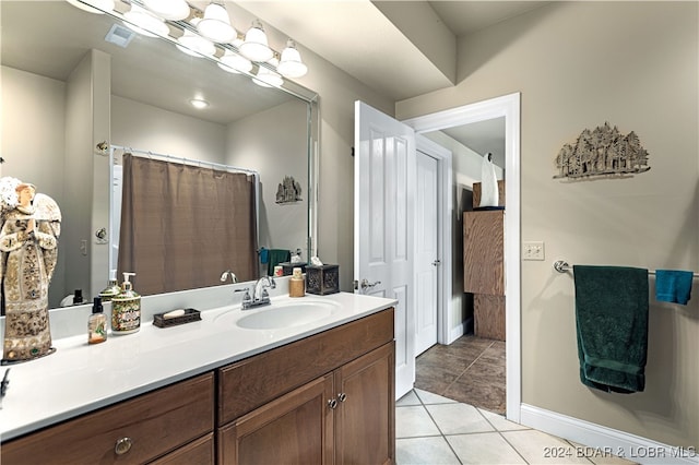 bathroom featuring vanity and tile patterned flooring