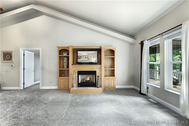 unfurnished living room featuring carpet and lofted ceiling