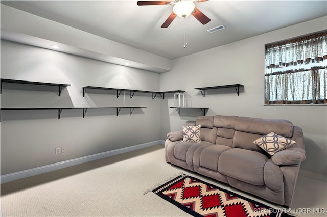 carpeted living room featuring ceiling fan