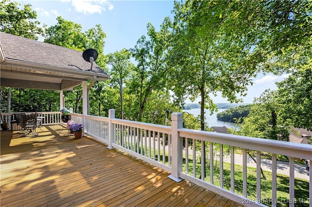 wooden deck with a water view