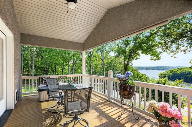 wooden deck with a water view