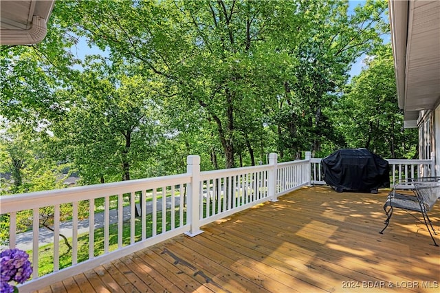 wooden deck featuring area for grilling